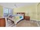 Comfortable bedroom featuring a king bed, a private balcony, and water views at 17408 Gulf Blvd # 1302, Redington Shores, FL 33708
