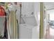 Convenient laundry area with a stacked washer and dryer at 17408 Gulf Blvd # 1302, Redington Shores, FL 33708