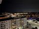 Night view of city buildings and lights with a clear night sky, perfect for relaxing evenings at 17408 Gulf Blvd # 1302, Redington Shores, FL 33708
