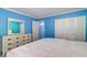 Spacious bedroom featuring large closet space and a comfortable bed at 200 Glennes Ln # 205, Dunedin, FL 34698