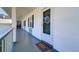Inviting entrance to unit 205 features a welcome mat and decorative wreath at 200 Glennes Ln # 205, Dunedin, FL 34698