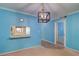 Living room featuring a pass-through window to the kitchen and an adjacent hallway at 200 Glennes Ln # 205, Dunedin, FL 34698