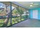 Patio featuring a large oak tree, beautiful scenery, and a ceiling fan at 200 Glennes Ln # 205, Dunedin, FL 34698