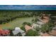 Expansive aerial view overlooking a lush, green landscape and a serene lake neighborhood at 2042 Diamond Ct, Oldsmar, FL 34677