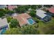 Aerial view of the house featuring a pool and tile roof at 2042 Diamond Ct, Oldsmar, FL 34677