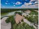 An aerial view showcases a lovely home near a lake, perfect for serene living at 2042 Diamond Ct, Oldsmar, FL 34677