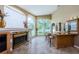 A full bar features display shelving, countertop seating, a fireplace and a great view at 2042 Diamond Ct, Oldsmar, FL 34677
