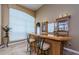 The bar area has bar stool seating, display shelves, and a serving area at 2042 Diamond Ct, Oldsmar, FL 34677