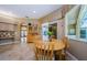 The breakfast nook showcases a wooden table, access to the lanai and views of the entry at 2042 Diamond Ct, Oldsmar, FL 34677