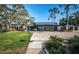 The Ardea Country Club features an outdoor dining area and lush landscaping at 2042 Diamond Ct, Oldsmar, FL 34677