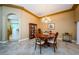 Charming dining room with tile flooring, wood furniture, and decorative chandelier at 2042 Diamond Ct, Oldsmar, FL 34677
