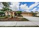 Stunning home with tile roof, mature landscaping, and a three-car garage at 2042 Diamond Ct, Oldsmar, FL 34677