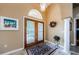 Open foyer with tile floors, arched doorway, high ceilings, and double door entry at 2042 Diamond Ct, Oldsmar, FL 34677