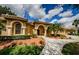 Beautiful front yard landscaping leading to the front entrance of the house at 2042 Diamond Ct, Oldsmar, FL 34677