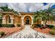 Close-up of the front entrance with well-maintained landscaping and decorative lights at 2042 Diamond Ct, Oldsmar, FL 34677