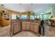 Well-equipped kitchen with stainless steel dishwasher, granite countertops, and bright lighting at 2042 Diamond Ct, Oldsmar, FL 34677