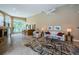 Inviting living room with a fireplace, wet bar, plush seating, and an open layout at 2042 Diamond Ct, Oldsmar, FL 34677