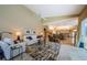 Bright living room with high ceilings, tile flooring, comfortable seating, and an open layout at 2042 Diamond Ct, Oldsmar, FL 34677