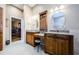 This bathroom features dual sinks with granite countertops and access to main bedroom at 2042 Diamond Ct, Oldsmar, FL 34677