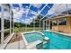 Screened pool with a hot tub provides an appealing outdoor living space at 2042 Diamond Ct, Oldsmar, FL 34677