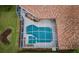 A beautiful screened pool surrounded by tile roofing, offering a private outdoor oasis at 2042 Diamond Ct, Oldsmar, FL 34677