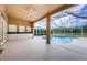 Enclosed pool patio with a wet bar, fan and serene views at 2042 Diamond Ct, Oldsmar, FL 34677