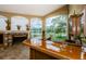Close up view of the wet bar with a shiny counter, sink, and storage, perfect for entertaining guests at 2042 Diamond Ct, Oldsmar, FL 34677