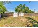 Large backyard with wooden fence and storage sheds at 2639 28Th N Ave, St Petersburg, FL 33713