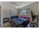 Bedroom featuring a ceiling fan, natural light, and a comfortable futon at 2639 28Th N Ave, St Petersburg, FL 33713
