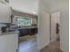 Modern kitchen with stainless steel appliances, stone countertops, and ample cabinet space at 2639 28Th N Ave, St Petersburg, FL 33713