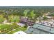 Stunning aerial view showcases the golf course, tennis courts, and community amenities at 2671 Clubhouse N Dr, Clearwater, FL 33761