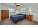 Bedroom with natural light, carpet and wooden furnishings at 2671 Clubhouse N Dr, Clearwater, FL 33761