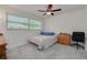 Bedroom with natural light, carpet and wooden furnishings at 2671 Clubhouse N Dr, Clearwater, FL 33761