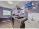 Laundry room equipped with modern appliances, storage shelves, and a utility sink at 2671 Clubhouse N Dr, Clearwater, FL 33761