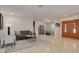 Spacious living room with tile floors, neutral decor, and comfortable seating at 2671 Clubhouse N Dr, Clearwater, FL 33761