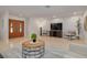 Bright living room featuring tile floors, recessed lighting, and stylish furnishings at 2671 Clubhouse N Dr, Clearwater, FL 33761