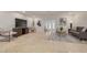 Open living area with tile floors, modern decor, and comfortable furniture arrangement at 2671 Clubhouse N Dr, Clearwater, FL 33761