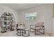 Bright living room with modern decor featuring unique bookshelf, comfortable seating, and ample natural light at 2671 Clubhouse N Dr, Clearwater, FL 33761