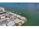 Beautiful aerial view of waterfront condo community with boat docks and lush landscaping at 2675 St Josephs E Dr # C, Dunedin, FL 34698
