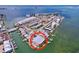 Aerial view of waterfront condo community near shopping, dining, and bridge with ocean views at 2675 St Josephs E Dr # C, Dunedin, FL 34698