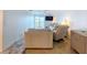 Comfortable living area with a sliding glass door to a balcony and ceramic tile flooring at 2675 St Josephs E Dr # C, Dunedin, FL 34698