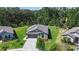 Aerial view of a single-Gathering home with a manicured lawn at 2821 Lytton Hall Dr, Zephyrhills, FL 33540