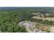 Birds-eye view of homes in a residential area bordered by expansive woodlands at 2821 Lytton Hall Dr, Zephyrhills, FL 33540