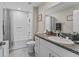 Bathroom featuring a single sink vanity with granite countertop and bathtub with shower at 2821 Lytton Hall Dr, Zephyrhills, FL 33540
