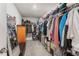 Walk-in closet featuring metal shelving and organized clothing and accessories at 2821 Lytton Hall Dr, Zephyrhills, FL 33540