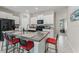 Well-appointed kitchen with granite countertops, stainless steel appliances, and a breakfast bar at 2821 Lytton Hall Dr, Zephyrhills, FL 33540