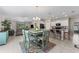 Open-concept kitchen and living space with tile floors and modern decor at 2821 Lytton Hall Dr, Zephyrhills, FL 33540