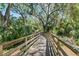 Scenic community walking trail through lush greenery, perfect for peaceful strolls and nature enjoyment at 2821 Lytton Hall Dr, Zephyrhills, FL 33540