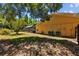 The backyard features a screened-in pool enclosure and lush greenery, offering a private outdoor space at 305 Bryan Oak Ave, Brandon, FL 33511