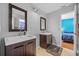 Bathroom featuring two sinks and access to a bedroom with a blue color scheme at 305 Bryan Oak Ave, Brandon, FL 33511
